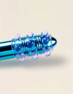 Manchette Sleeve Crystal Touch violet avec reliefs stimulants – accessoire plaisir Jardin Intime