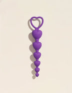 Perles anales Sweet Heart violettes en silicone, forme progressive en cœurs